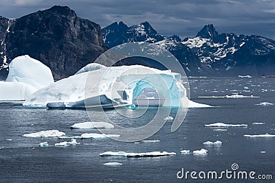 Iceberg with turquoise gate near Kap Farvel, Greenland Stock Photo