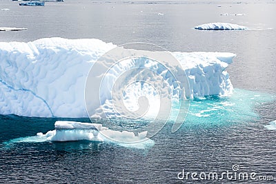 Iceberg with turquoise shining water, Greenland Stock Photo