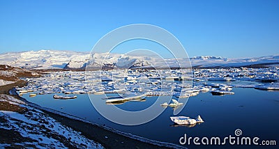 Iceberg reflection at sunrise at Jokulsarlon in Iceland Stock Photo