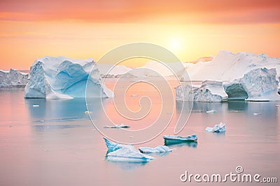 Icebergs in the Atlantic ocean at sunset, Greenland Stock Photo