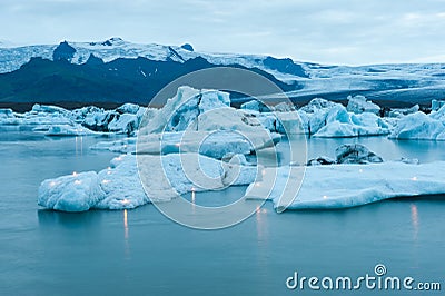 Icebergs with candles, Jokulsarlon ice lagoon before annual firework show, Iceland Stock Photo