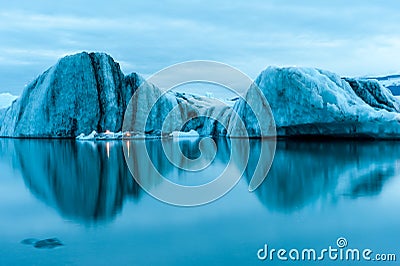 Icebergs with candles, Jokulsarlon ice lagoon before annual firework show, Iceland Stock Photo