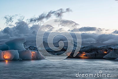 Icebergs with candles, Jokulsarlon ice lagoon before annual firework show, Iceland Stock Photo