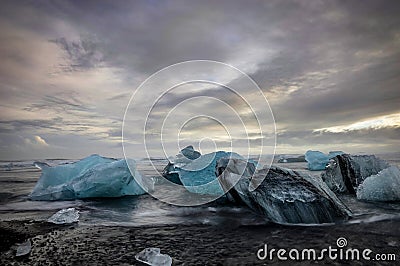 Icebergs floating in Jokulsarlon glacier lake at sunset in Icela Stock Photo