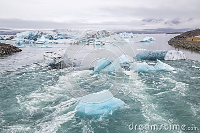 Icebergs floating out to sea at Glacier Lagoon in Iceland Stock Photo