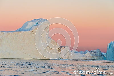 Icebergs in the midnight sun, Ilulissat, Greenland Stock Photo