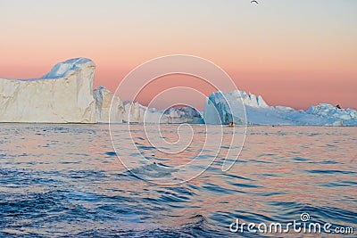 Icebergs in the midnight sun, Ilulissat, Greenland Stock Photo