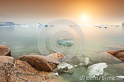 Icebergs on the shore of Atlantic ocean, western Greenland Stock Photo