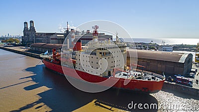 Icebreaker ship in the harbor with the background of the city. Stock Photo