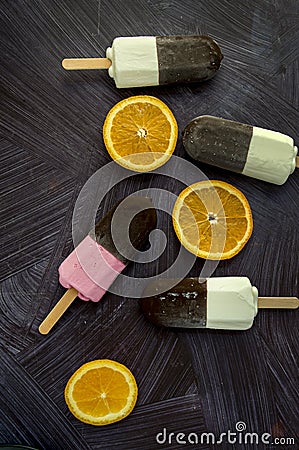 Icecreams and orange slices Stock Photo