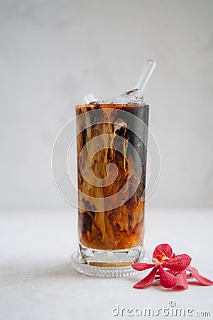 Iced americano with milk on the table Stock Photo