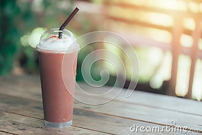Iced blend smoothie milk chocolate whip cream on wood table Stock Photo
