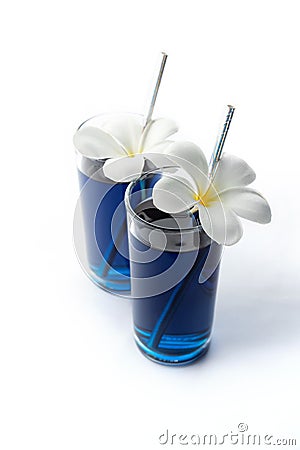 Iced blue butterfly pea drinks tropical flowers decor. Healthy thai traditional cocktails in glasses Stock Photo