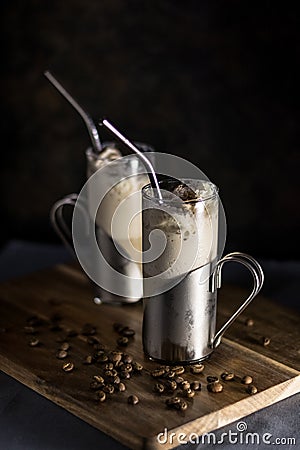 Iced coffee chillers in tall glass mugs with coffee beans Stock Photo
