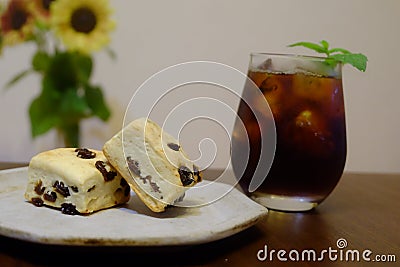 Iced coffee and raisin scone Stock Photo