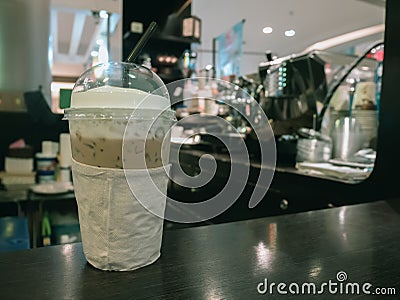 Iced coffee on table in cafe Stock Photo