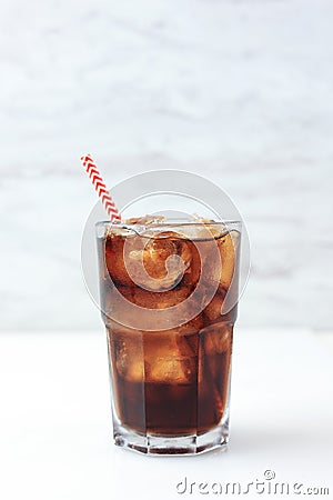 Iced Cola on Tall Glass with Red Stripes Paper Straw Stock Photo