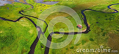 Iceland. Aerial view on the alone house, field and river. Panoramic landscape in the Iceland at the day time. Landscape from drone Stock Photo