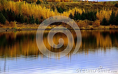 Iceland autumn lake reflecting colors Stock Photo
