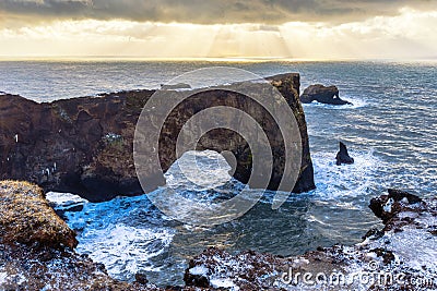 Iceland dyrholaey rock arch, winter in Iceland, dyrholaey arch in winter Stock Photo