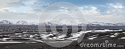 Iceland highlands autumn ultrawide view. Lava fields of volcanic sand in foreground. Hrauneyjalon lake and volkanic snow covered Stock Photo