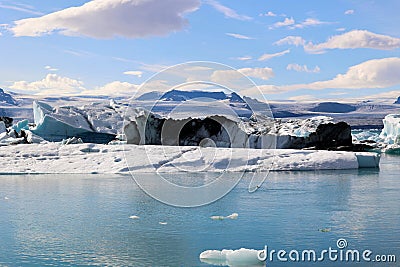 Iceland iceberg in Jökulsárlón glacier lagoon with Vatnajökull National Park in the background Stock Photo