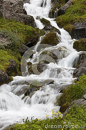 Iceland. Seydisfjordur. Waterfall and basaltic rocks. Stock Photo