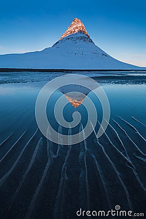 Iceland snaefellsnes peninsula and famous Kirkjufell. Kirkjufell is a beautifully shaped and a symmetric, free standing mountain. Stock Photo