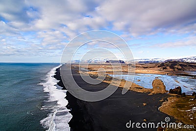 Iceland endless black sand beach seen from Dyrholaey cap Stock Photo