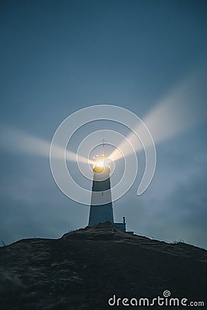 An Icelandic lighthouse in the moody dark night. Abstract image, dark mood. Iceland Stock Photo