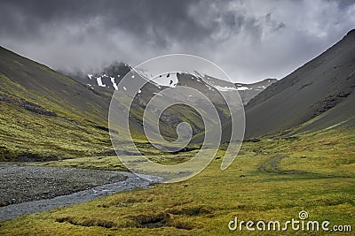 Icelandic mountain scape with dark cloud cover Stock Photo