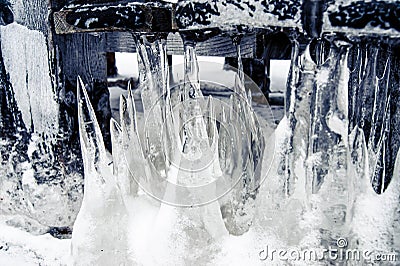 Icicles come out of the ground. Cold winter and snowy winter Stock Photo