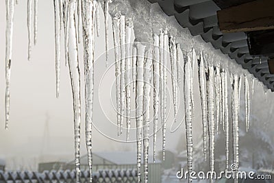 Icicles on the eaves Stock Photo