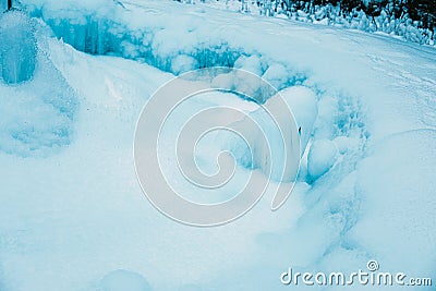 Icicles formed around frozen geyser.Winter image.High quality photo Stock Photo