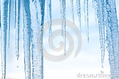 Icicles hanging down with blue sky Stock Photo