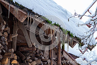 Icicles Hanging From A Roof. Roof Icicles. Spring Melting Snow. Stock Photo