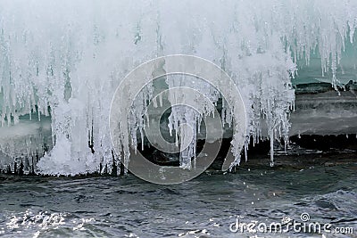 Icicles ice water river pattern Stock Photo