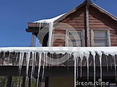 Icicles surrounding a roof Stock Photo