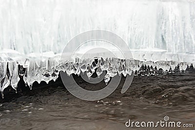 Icicles and water flow Stock Photo