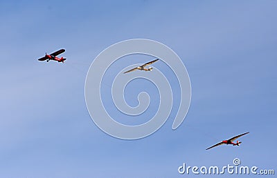 Vintage 1961 Piper PA-18-150 Super Cub aircraft towing two vintage gliders Editorial Stock Photo