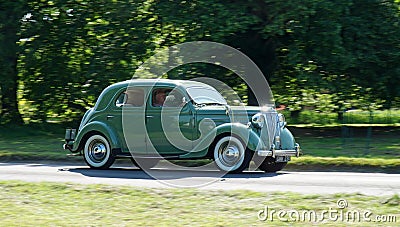 Vintage 1950 Ford V8 Pilot 3.6 Litre Car driving past on country road. Editorial Stock Photo
