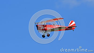 Vintage Red 1949 Stampe Vertongen Biplane in flight Editorial Stock Photo