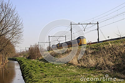 ICM koploper intercity train in railroad track at Zevenhuizen Editorial Stock Photo