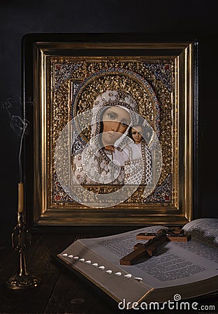 Icon of the Kazan mother of God in a gold frame, embroidered with pearls and beads. Editorial Stock Photo