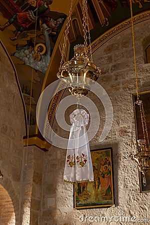 An icon lamp hangs from the ceiling in a hall in the small monastery of St. George on the border of the Jewish and Armenian Editorial Stock Photo