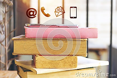icon mobile phone, mail, telephone and address. Customer service call center contact us concept with black phone above book. Stock Photo
