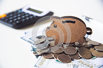 Icon piggy save placed on pile of money -concept save money Stock Photo