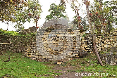 Iconic ancient stone round house ruins with unique geometric pattern on the outside wall, Kuelap archaeological site in Peru Stock Photo