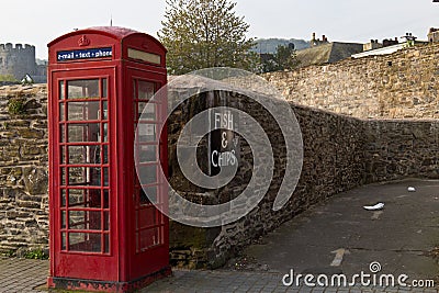 Iconic British red telephone box in Conwy, Wales Stock Photo