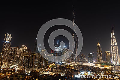 Iconic panorama at night of Burj Khalifa and Dubai Skyline with beautiful night colors on other skyscrapers in the Middle East Editorial Stock Photo